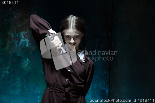 Image of Portrait of a young girl in school uniform as killer woman