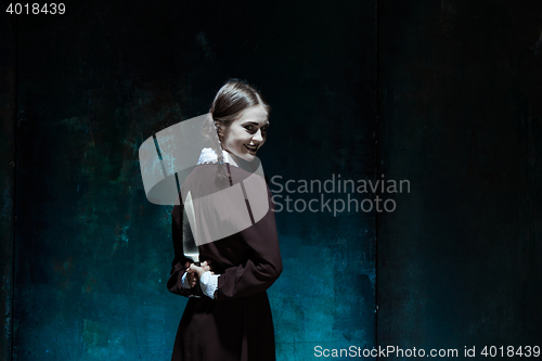 Image of Portrait of a young girl in school uniform as killer woman