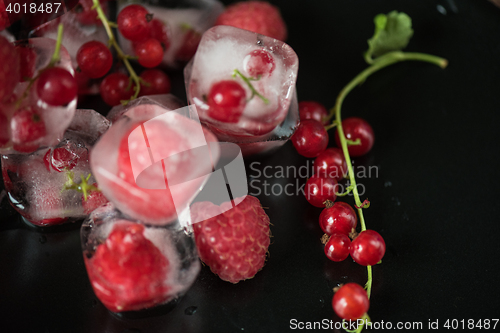 Image of Frozen berries on wooden table