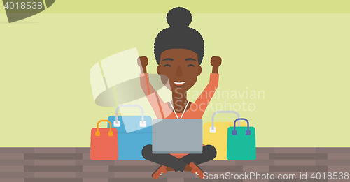 Image of Woman shopping online using her laptop.