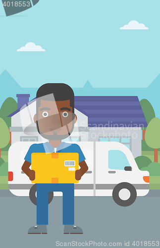 Image of Delivery man carrying cardboard boxes.