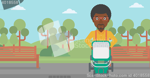 Image of Father walking with baby stroller.