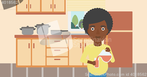 Image of Pregnant woman pouring juice.