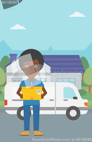 Image of Delivery woman carrying cardboard boxes.