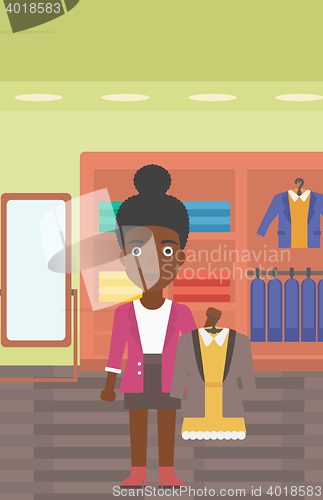 Image of Woman holding dress with jacket.