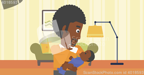 Image of Father feeding baby.