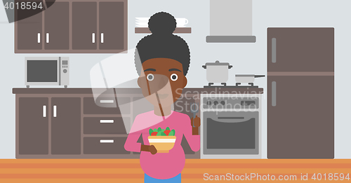 Image of Pregnant woman with vegetables and fruits.