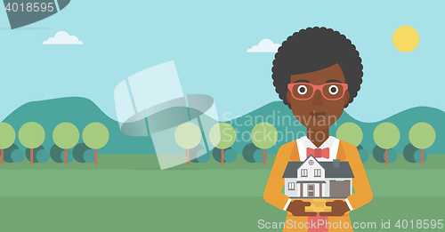 Image of Woman holding house model vector illustration.