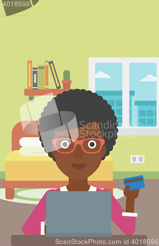 Image of Woman shopping online using her laptop.