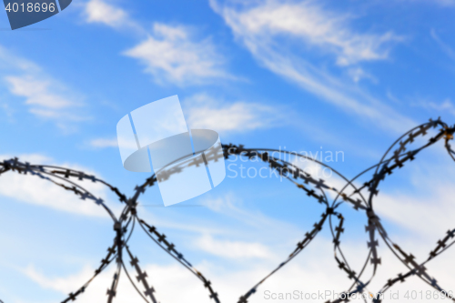 Image of barbed wire, sky