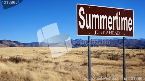Image of Summertime Just Ahead brown road sign