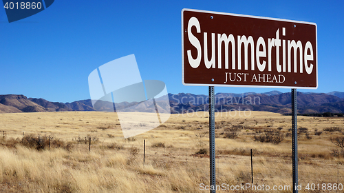 Image of Summertime Just Ahead brown road sign