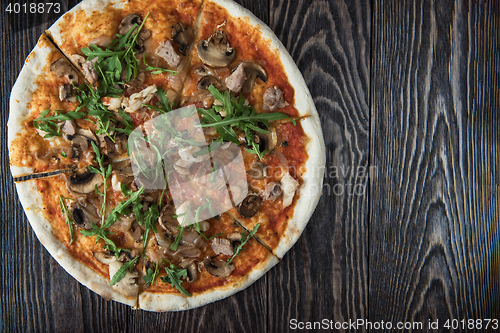 Image of Pizza with chicken and mushrooms