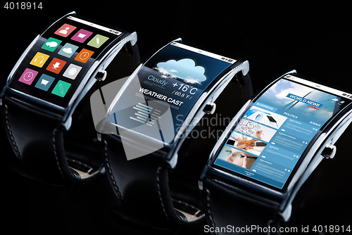 Image of close up of black smart watch set with multimedia