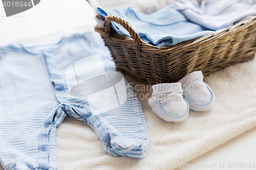 Image of close up of baby clothes for newborn boy in basket