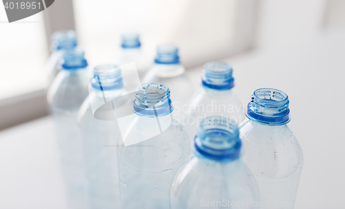 Image of close up of empty used plastic bottles on table