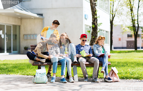 Image of group of students with notebooks at school yard