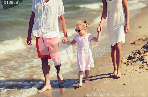 Image of happy family in sunglasses on summer beach