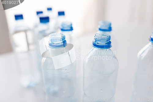 Image of close up of bottles with drinking water on table