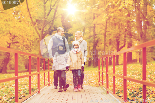 Image of happy family in autumn park