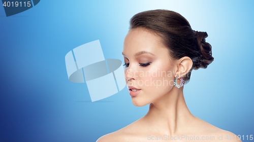 Image of close up of beautiful woman face with earring