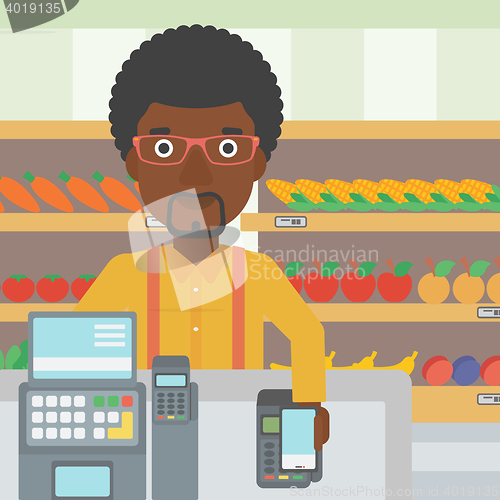 Image of Customer paying wireless with smartphone.