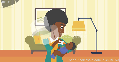 Image of Mother feeding baby.