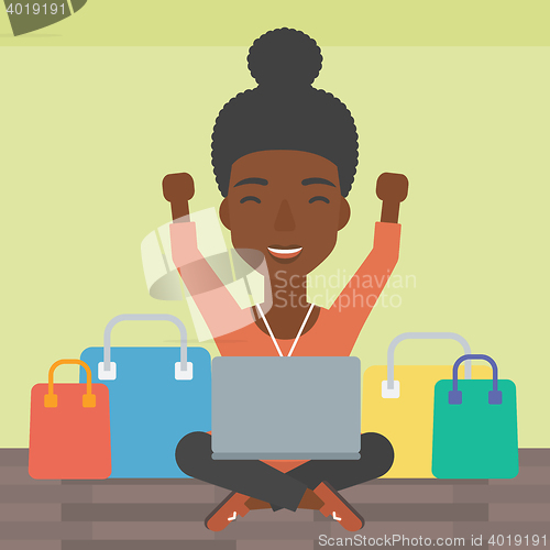 Image of Woman shopping online using her laptop.