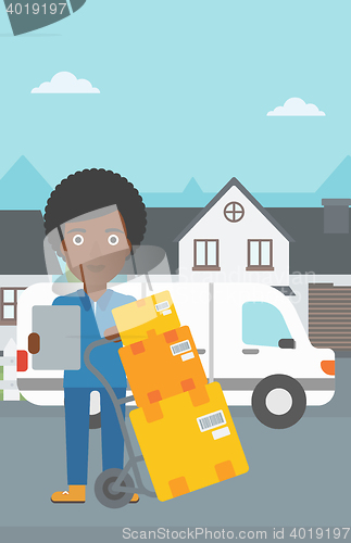 Image of Delivery woman with cardboard boxes.