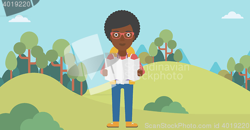 Image of Traveler with backpack looking at map.