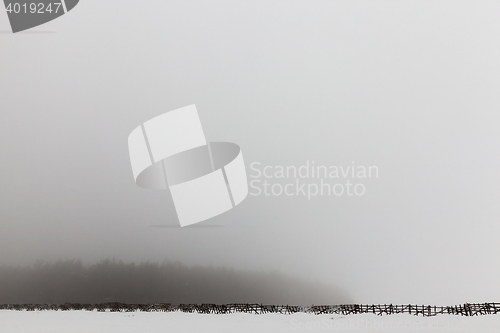 Image of wooden fence in a field