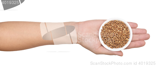 Image of hand with buckwheat