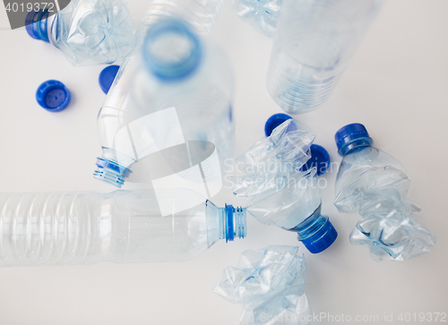 Image of close up of empty used plastic bottles on table