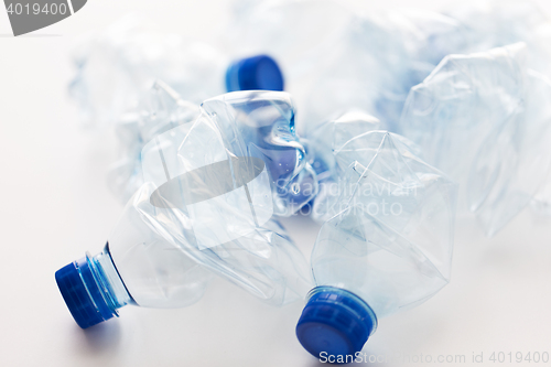 Image of close up of empty used plastic bottles on table