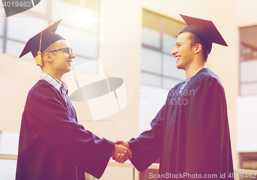 Image of smiling students in mortarboards