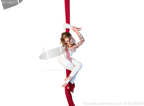 Image of Graceful gymnast performing aerial exercises