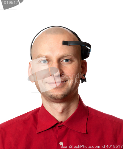 Image of Portrait of young man with EEG headset on head