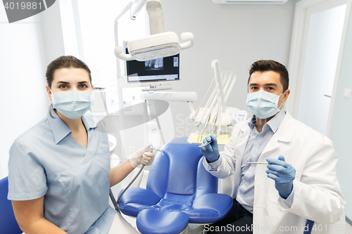 Image of close up of dentist and assistant at dental clinic