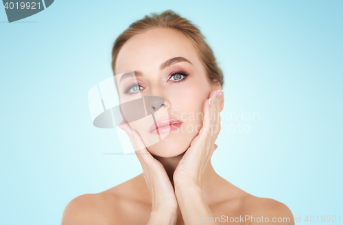 Image of beautiful young woman face and hands