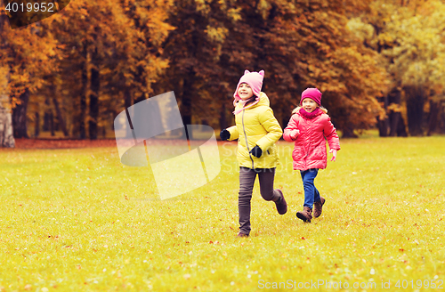 Image of group of happy little girls running outdoors