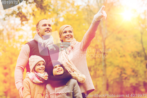 Image of happy family in autumn park