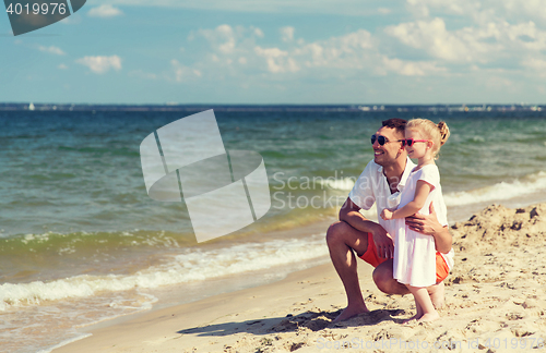 Image of happy family in sunglasses on summer beach