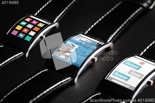 Image of close up of black smart watch set with multimedia