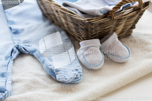 Image of close up of baby clothes for newborn boy in basket