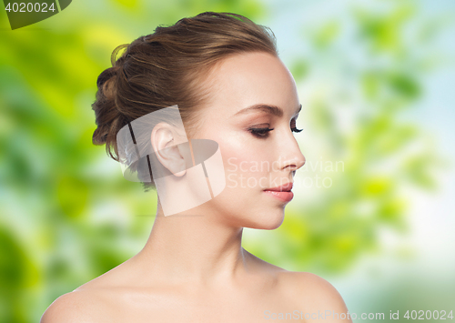 Image of beautiful young woman face over white background