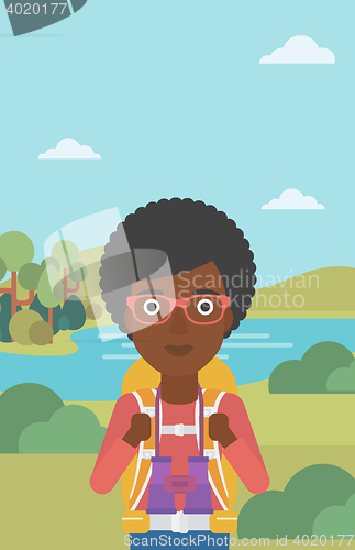 Image of Cheerful traveler with backpack.