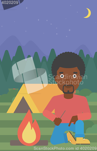 Image of Man kindling campfire vector illustration.