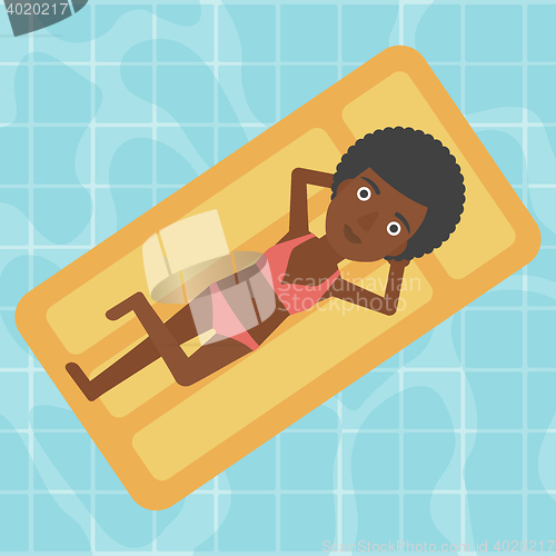 Image of Woman relaxing in swimming pool.