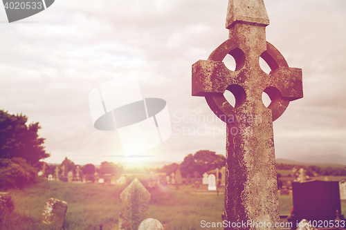 Image of old grave cross on celtic cemetery in ireland