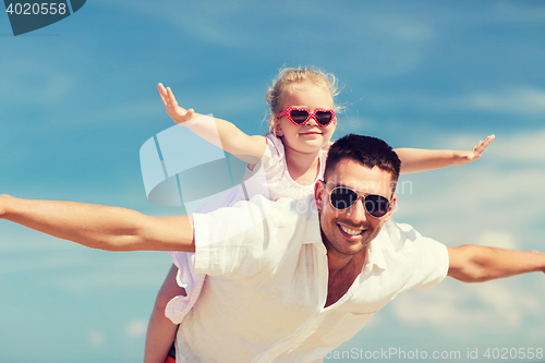 Image of happy family having fun over blue sky background